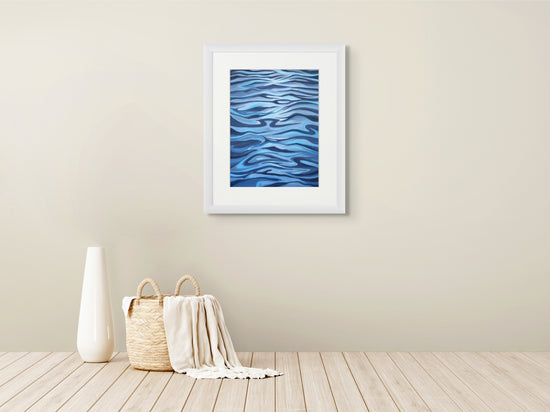 Blue Tide art print framed on wall, coastal painting by Ellie Antonacci
